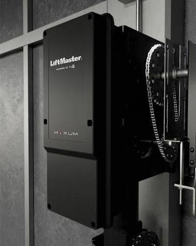 Commercial door operator mounted above a warehouse door